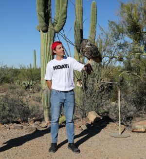 A man holds an eagle on his glove